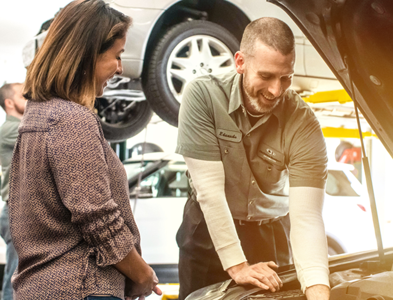 An Oviedo Mechanic Explains an Auto Repair Service to a Customer