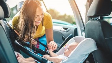 Mother and baby going to get a car oil change