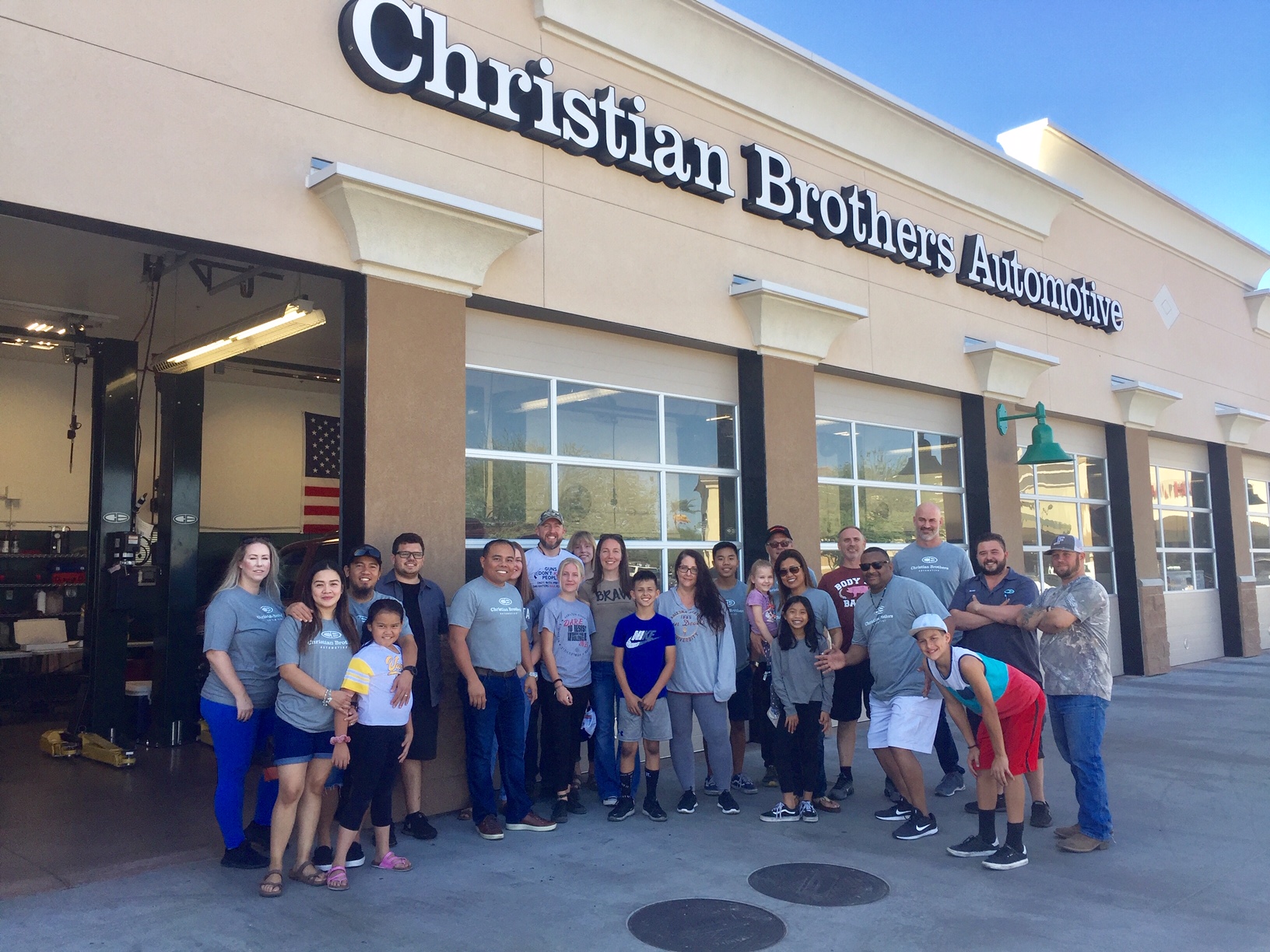 families in front of christian brothers automotive