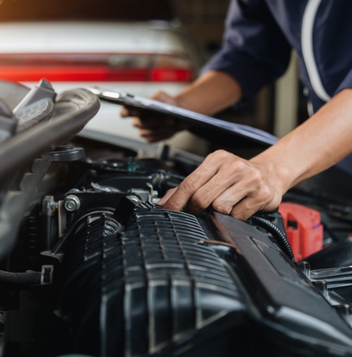 mechanic performing vehicle inspection