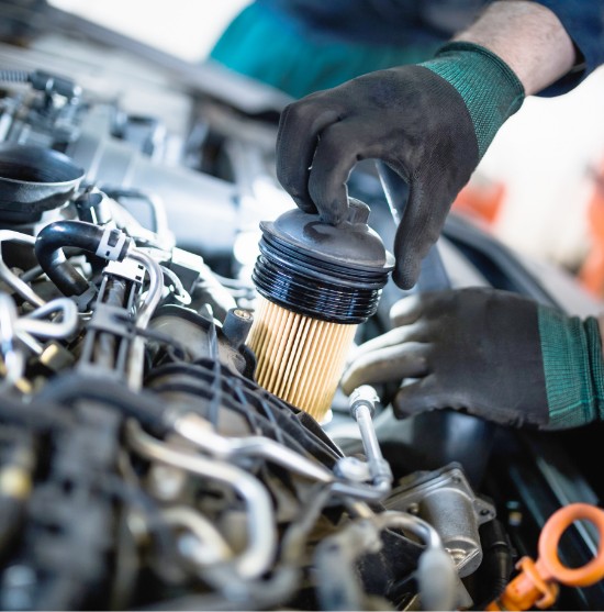 Mechanic performing an oil change