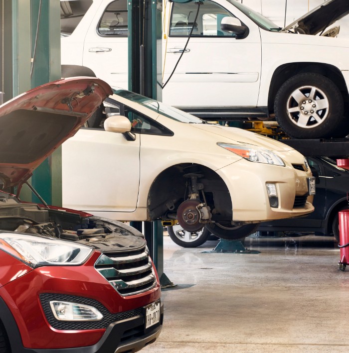 cars on lifts in garage