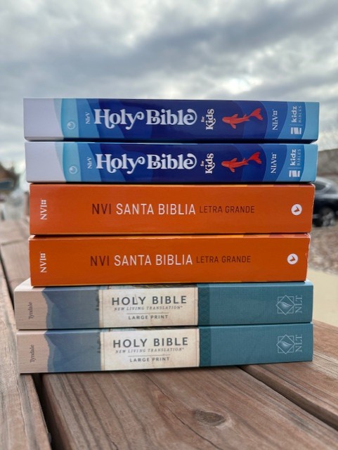 a stack of bibles on a table